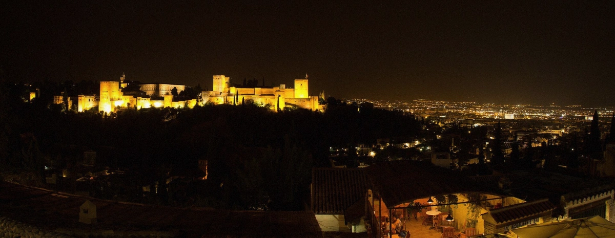 Night view over the illuminated Alhambra grounds in Granada, Spain