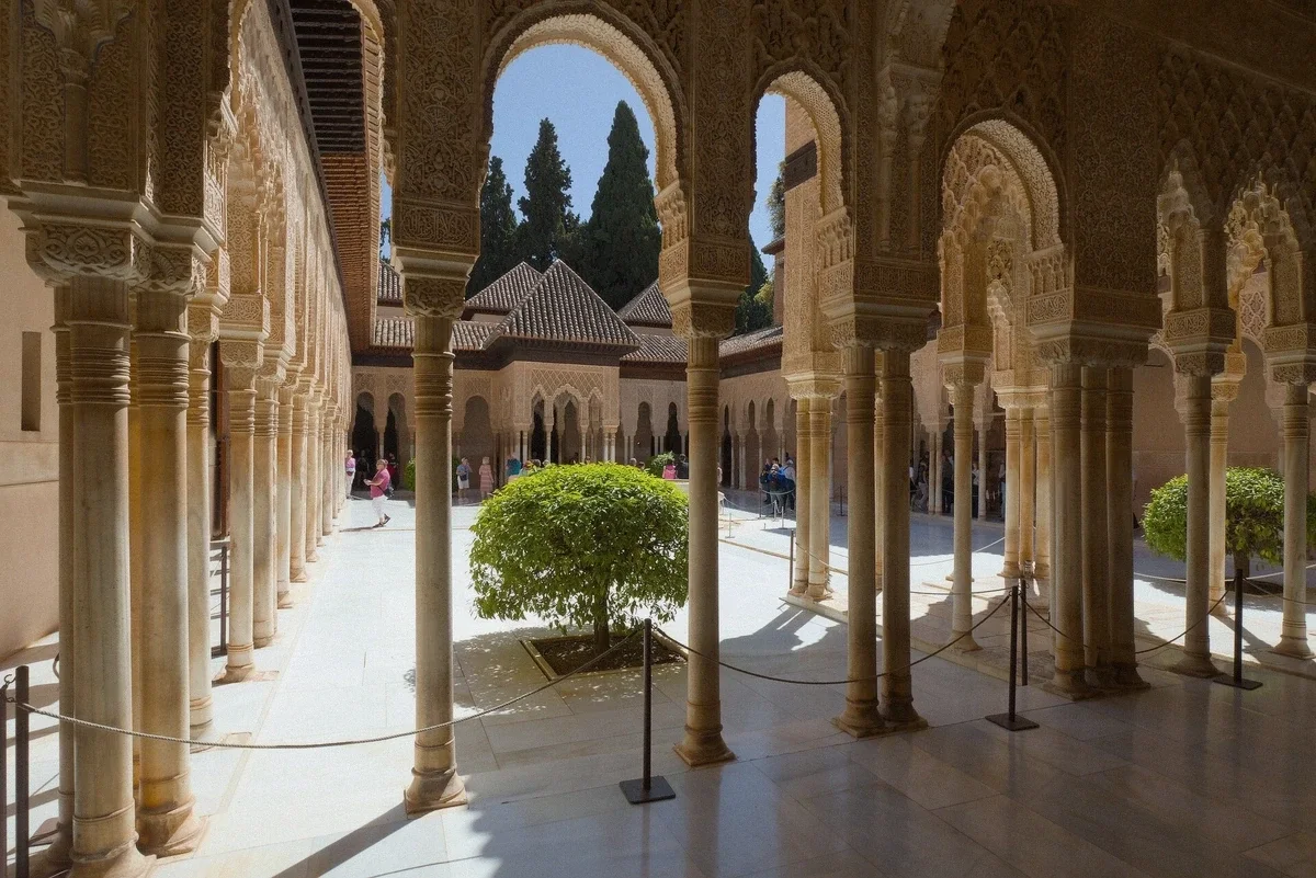 The Court of the Lions and its fountain in the Nasrid Palaces, Alhambra, Granada