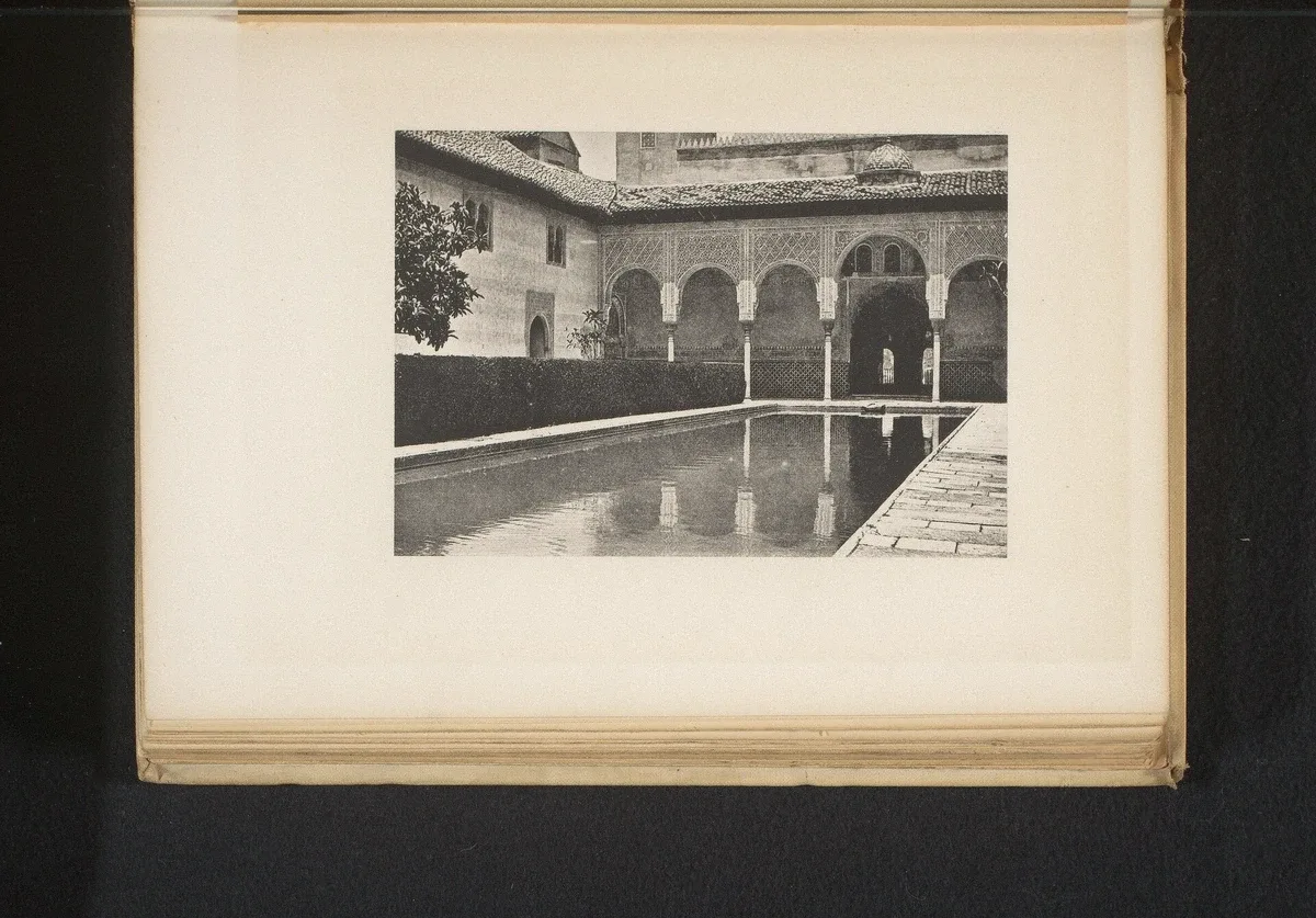 Court of the Myrtles with its reflecting pool and the Comares tower in the Nasrid Palaces, Alhambra, Granada